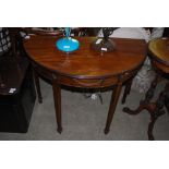 A 20TH CENTURY MAHOGANY DEMI LUNE SIDE TABLE, THE BODY WITH CARVED FOLIATE SWAG FRIEZES ON