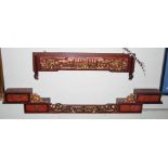 A 20TH CENTURY CHINESE CARVED DARK WOOD, RED LACQUER AND GILT WALL MOUNTED SHELVED GALLERY, FORMED
