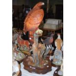 A LARGE SCOTTISH ART PAINTED RESIN FIGURE OF A GOLDEN EAGLE (DAMAGES) ON A WOODEN BASE, 75CM HIGH