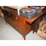 CHINESE DARK WOOD SIDEBOARD FITTED WITH THREE FRIEZE DRAWERS OVER CUPBOARD DOORS BELOW.