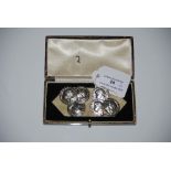 SIX STERLING SILVER CIRCULAR BUTTONS WITH CHASTE DECORATION OF A YOUNG GIRL IN PROFILE WITHIN LAUREL
