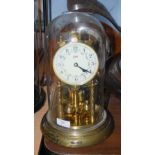 A 20TH CENTURY GERMAN BRASS ANNIVERSARY CLOCK INSIDE A GLASS DOME, THE MOVEMENT STAMPED '