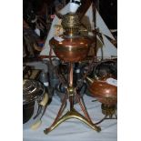 EARLY 20TH CENTURY COPPER AND BRASS OIL LAMP CONVERTED TO A TABLE LAMP BY BENSON, THE CIRCULAR