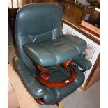 MODERN GREEN LEATHER EASY CHAIR TOGETHER WITH MATCHING FOOTSTOOL, BOTH ON ROUND WOODEN SUPPORTS,