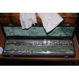 A 20TH CENTURY ITALIAN SILVER-PLATED FLUTE MADE BY J M GRASSI OF MILAN, INSIDE A FITTED BLACK