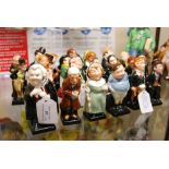 SET OF TWENTY-FOUR ROYAL DOULTON DICKENS FIGURES.