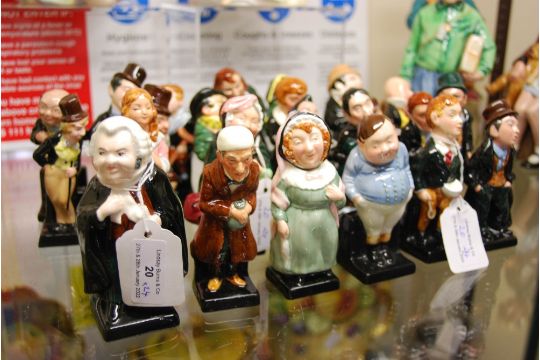 SET OF TWENTY-FOUR ROYAL DOULTON DICKENS FIGURES.