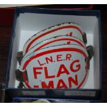 RAILWAYANA - THREE VINTAGE RED AND WHITE ENAMEL ARMBANDS, COMPRISING L.N.E.R. 'FLAG-MAN', C.R. '