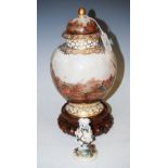 A DRESDEN PORCELAIN URN AND COVER WITH HAND PAINTED DECORATION OF FISHERMAN LANDING THE CATCH ON
