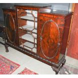 A 20TH CENTURY BREAKFRONT SIDE CABINET, THE CENTRAL ASTRAGAL GLAZED DOOR WITH FOUR GREY VELVET LINED