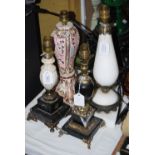 FOUR TABLE LAMPS TOGETHER WITH THREE ONYX ITEMS, TWO LAMPS IN GILT METAL MOUNTED MARBLE, ONE IN