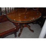 LATE 19TH CENTURY WALNUT AND EBONISED CENTRE TABLE OF OVAL FORM, THE TOP WITH CENTRE MARQUETRY