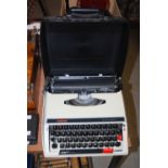 VINTAGE BROTHER DELUXE 660TR TYPEWRITER INSIDE BLACK PLASTIC CARRY CASE, 36CM LONG.