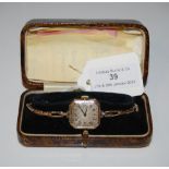 VINTAGE 9CT GOLD CASED LADIES ROLEX WITH OCTAGONAL SILVERED DIAL BEARING ARABIC NUMERALS.