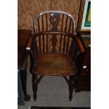 A 19TH CENTURY ELM, FRUIT WOOD AND YEW WINDSOR CHAIR, WITH SIX BACK RAILS CENTRED AROUND A CENTRE