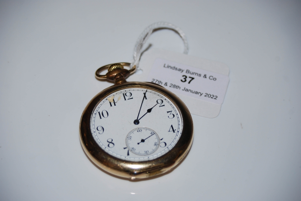 VINTAGE YELLOW METAL CASED OPEN-FACED POCKET WATCH WITH BLACK AND WHITE ARABIC NUMERAL DIAL