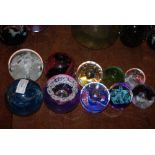 TEN ASSORTED CAITHNESS GLASS PAPERWEIGHTS.