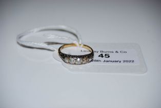 EARLY 20TH CENTURY YELLOW METAL FIVE STONE DIAMOND RING, STAMPED '18C'.