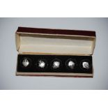 BOXED SET OF FIVE SIAM STERLING SILVER BUTTONS OF SHAPED CIRCULAR FORM WITH ENGRAVED SCROLL DETAIL.