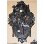 A PAIR OF LATE 19TH / EARLY 20TH CENTURY CONTINENTAL BLACK FOREST EBONISED CARVED WOOD HUNTING