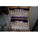 LATE 19TH CENTURY WALNUT CASED SET OF TWELVE MOTHER OF PEARL HANDLED FRUIT KNIVES AND FORKS.