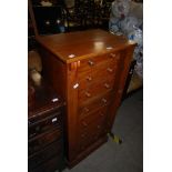 A 19TH CENTURY MAHOGANY WELLINGTON CHEST OF TALL RECTANGULAR PROPORTIONS WITH SEVEN GRADUATED