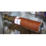 A VINTAGE LEATHER AND BRASS THREE-DRAW TELESCOPE, BRITANNIC.
