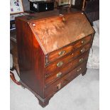 A 19TH CENTURY MAHOGANY DROP FRONT BUREAU, THE DROP TOP WITH GREEN FELT SKIVER, FITTED PIGEON