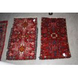 TWO 20TH CENTURY PERSIAN PRAYER MATS, BOTH WITH DARK RED GROUNDS AND TWO MEDALLIONS IN PINK, CREAM