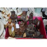 A GROUP OF TWELVE CARVED WOODEN FIGURES, INCLUDING CONTINENTAL FIGURES OF PEASANTS, INDIAN FIGURES