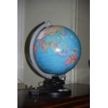 A GLOBE-FORM TABLE LAMP.