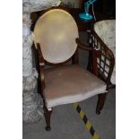 AN ART DECO MAHOGANY ARMCHAIR, THE BACK OF OVAL FORM UPHOLSTERED IN CREAM VELVET STYLE FABRIC,