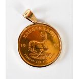 A 1981 gold South Africa Krugerrand, in 9ct gold mount, gross weight 37 grams.