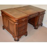 A 20th century George III style mahogany partners desk, the shaped rectangular top with three gilt