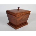 A late 19th / early 20th century mahogany cellarette, of sarcophagus form, the domed hinged top with