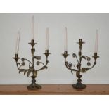 A pair of late 19th century gilt metal three-light candelabra, of naturalistic form as flowering
