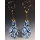 A pair of Chinese porcelain blue and white bottle vases converted to table lamps, Qing Dynasty,