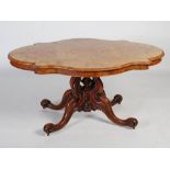 A Victorian walnut and burr walnut centre table, the burr walnut serpentine oval top raised on a