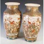 A pair of large Japanese Satsuma pottery vases, Meiji Period, decorated with panels of figures