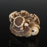 A Japanese carved ivory netsuke, probably Meiji Period, depicting a turtle with four of its young on