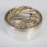 Jocelyn Burton, a silver plated circular box and cover, the detachable cover with embossed