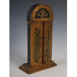 A late 19th/ early 20th century French travelling shrine, the painted and gilded wood two door