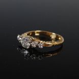 An early 20th century yellow and white metal five stone diamond ring, circa 1900, centred with an