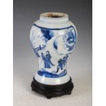 A Chinese porcelain blue and white jar, Qing Dynasty, decorated with panels of figures in fenced