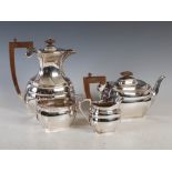 A George V silver four piece tea set, Birmingham, 1933, makers mark of RS, of plain octagonal shape,