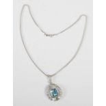 An Art Deco style white metal, aquamarine and diamond pendant on an 18ct white gold foxtail chain,