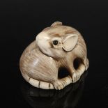 A Japanese carved ivory netsuke, probably Meiji Period, depicting a rat holding its tail, two