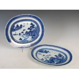 Two 19th century Chinese Export blue & white porcelain meat plates, of oval form with scenes of