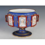 A late 19th century French Limoges style porcelain jardiniere, of oval form, the blue and gilt