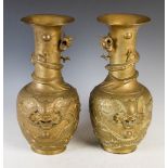 A pair of Chinese gilt metal vases, with long flared necks with applied dragons spiralling down to